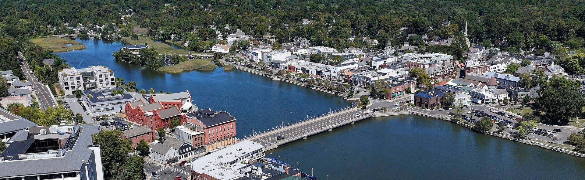 Aerial view of downtown Westport, Connecticut — Main Street shops, the Saugatuck River and the Post Road bridge